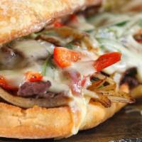 Truphilly Pepper Cheese Steak · Thinly sliced steak mixed with grilled onions, sweet bell peppers, and melted cheese