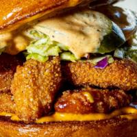 The Daring Sandwich · Daring plant patty, spiced chickpea aioli, pickles, coleslaw