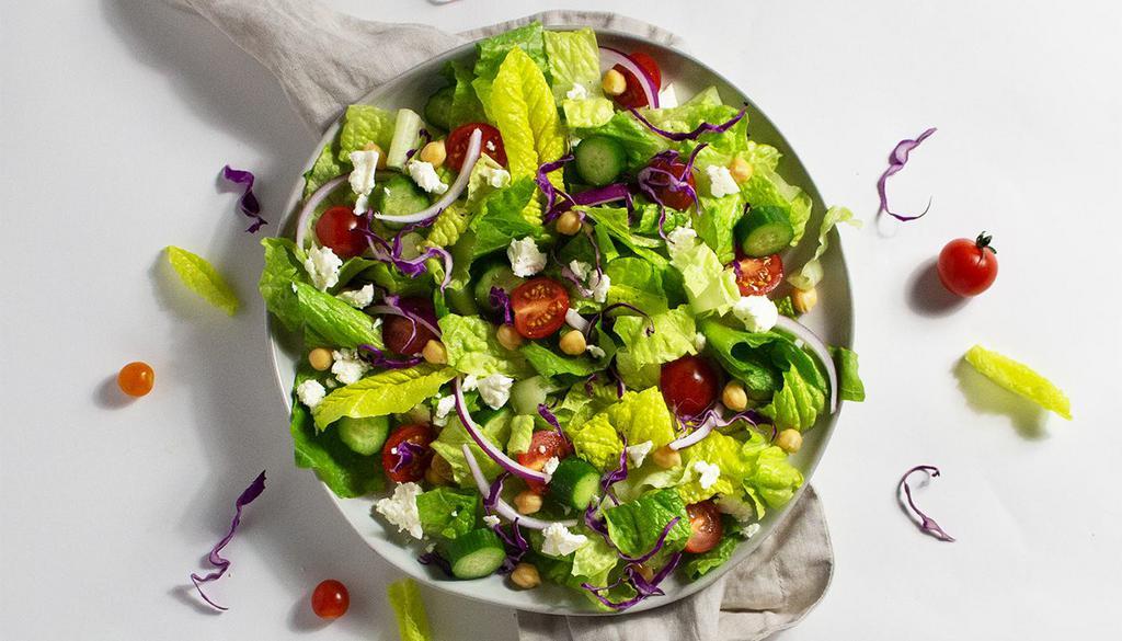 Mediterranean Salad · Chickpeas, cucumber, tomatoes, onions, and cabbage with your choice of greens and dressing.