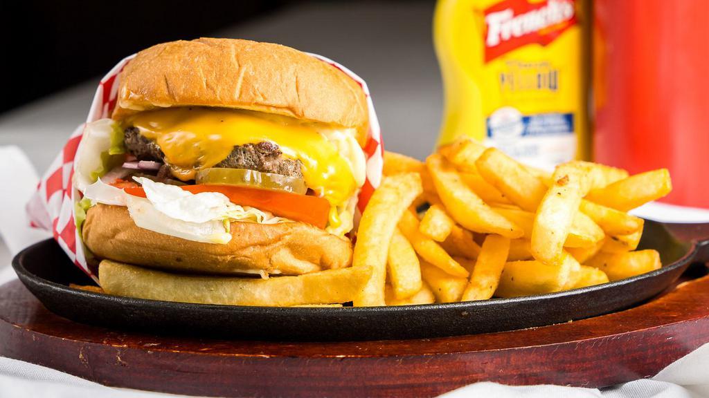 Cheeseburger · 1/2 lb Angus Beef patty seasoned with seven spices-topped with American cheese, lettuce, tomato, red onions, pickles, and our secret sauce.