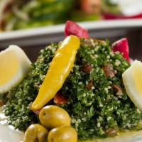 Tabouleh · Cracked wheat, tomatoes, parsley and lemon.