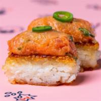 The Original Spicy Tuna Krispy Rice · Grilled sushi rice, spicy tuna tartare garnished with serrano. 2 pieces