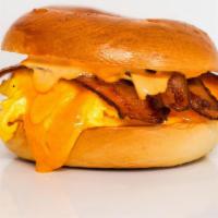 Bagel, Bacon, Egg, & Cheddar · 2 scrambled eggs, melted Cheddar cheese, smoked bacon, and Sriracha aioli on a toasted bagel.