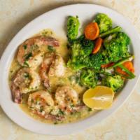Scampi Alla Laura · Served with a side of vegetables and pasta with marinara. Shrimp sautéed in butter, lemon, g...