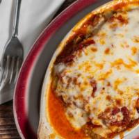Lasagna · Layers of homemade pasta baked with mozzarella cheese, meat, and marinara sauce.