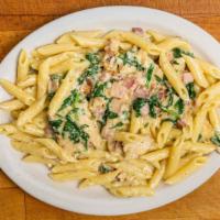 Chicken Carbonara · Penne with spinach, chicken, pancetta, egg, and Parmesan cheese.