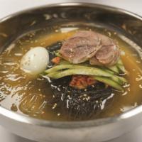 Naengmyeon/냉면/冷面 · Chilled buckwheat noodle soup. Top with beef, radish, cucumber and boiled egg.