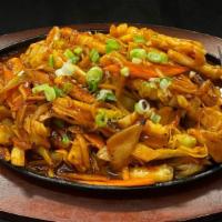 Ojingeo-Bokkeum/오징어볶음/炒鱿鱼 · This dish is made by stir-frying squids, onions, carrots and cabbage in a spicy sauce of Toc...