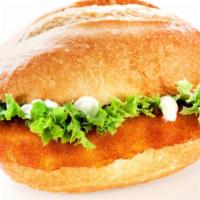 Fried Fish Sandwich · Delicious sandwich made with Fried Fish, spicy tartar sauce, slaw, and pickles.