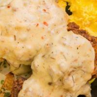 Cure · house biscuit, sausage gravy, tots, scrambled eggs choice of:spicy chicken sausage, fried ch...