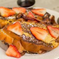 French Toast · custardy challah bread, strawberry, syrup, Nueske’s apple-wood bacon