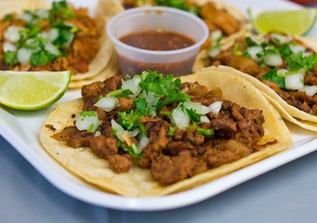 Taco · Soft corn tortillas, choice of meat, onions, cilantro and salsa.