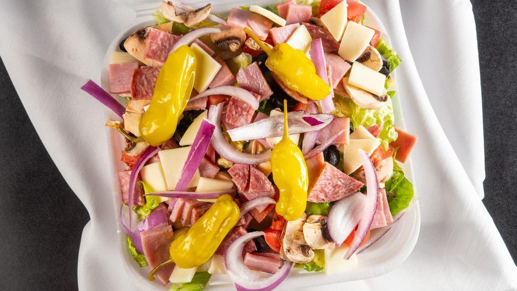 Antipasto Salad (Small) · Italian ham, salami, mushrooms, black olives, vine-ripened tomatoes, red onions, Italian Peperoncino, topped with feta, provolone and cheese.