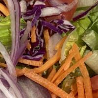House Salad (Large) · Crisp green lettuce, cut tomatoes, red onions, carrots, and red cabbage.