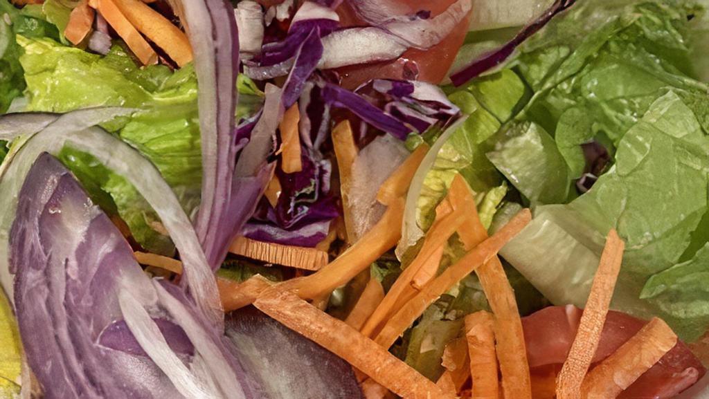 House Salad (Large) · Crisp green lettuce, cut tomatoes, red onions, carrots, and red cabbage.