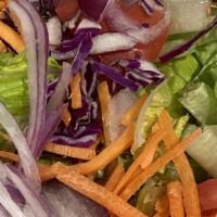 House Salad (Small) · Crisp green lettuce, cut tomatoes, red onions, carrots, and red cabbage.