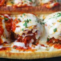 Homemade Meatball · Our special Italian meatballs layered with mozzarella cheese, Parmigiano cheese, topped with...