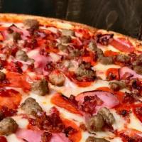 Meat Lovers Pizza · Pizza topped and stuffed with ham, pepperoni, sausage, and bacon.