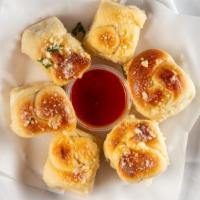 Garlic Knots (6) · Our famous bread roll 
