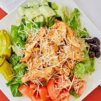 Grilled Chicken · Garden salad topped with marinated grilled chicken, parmesan cheese, and Caesar dressing.