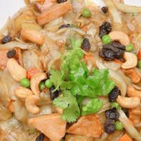 Vegan Pineapple Noodles · Stir fried rice noodles with onions, pineapples, raisins, cashew nuts, curry powder, , and v...