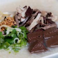 Porridge & Blood Jelly (Borbor Chiem Jrouk) · Porridge is the quintessential cambodian breakfast dish. Prepared with whole grain rice, por...