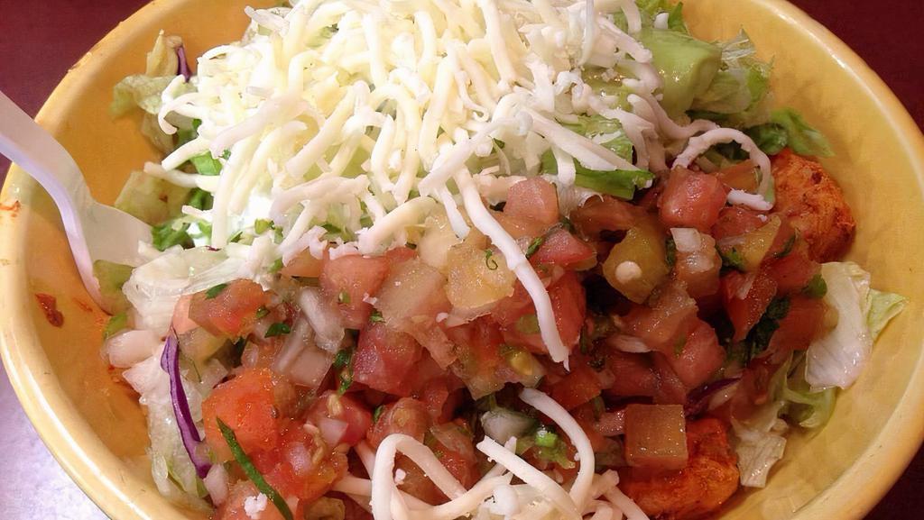 Burrito Bowl · Choice of meat, pinto beans, rice, lettuce, cheese, sour cream, guacamole and pico de gallo.