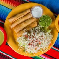 Flautas (4) · 4 hand-rolled​ chicken flautas topped with lettuce, sour cream, cheese and guacamole.