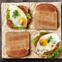 Sausage & Egg Sandwich · Two eggs ,sausage,mayo,lettuce and tomato served with choice of the white or wheat toast.