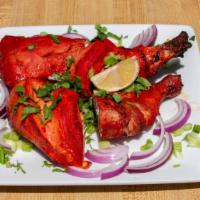 Chicken Tandoori · Grilled chicken marinated in yogurt and spices.