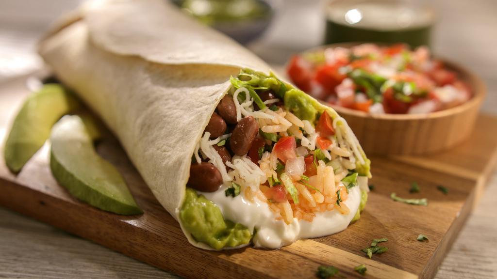 Vegetarian Burrito · Rice, beans, lettuce, pico de gallo, sour cream, cheese, and guacamole.