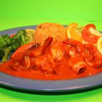 Camarones A La Diabla · Spicy deviled shrimp cooked in a hot red sauce served with rice, vegetable, and salad. (4 co...