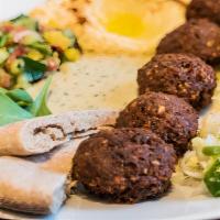 Falafel Plate · Crispy vegetarian falafels served with homemade pita bread and choice of 3 sides.