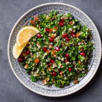 Tabouli Salad · Tomatoes, finely chopped parsley, mint, bulgur, and onion, and seasoned with olive oil and l...