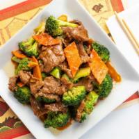 Beef Broccoli · Beef with broccoli and carrots cooked in a brown garlic sauce.