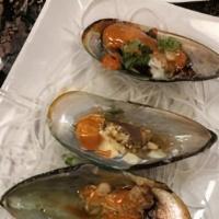 Baked Green Mussel · Mussels baked with unagi sauce, white sauce, green onion and masago.