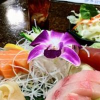 Sora'S Sashimi Plate · Come with house salad. Chef's choice of 12 pieces of assorted sashimi.