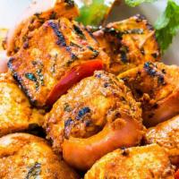 Paneer Tikka · Paneer cubes marinated in yogurt and spices cooked in tandoor.