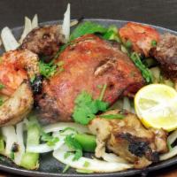Mixed Grill · A variety of chicken tikka, reshmi kabab, seekh kabab and tandoori shrimp.