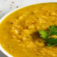 Yellow Daal · Yellow lentils stew with cumin, cilantro and spices