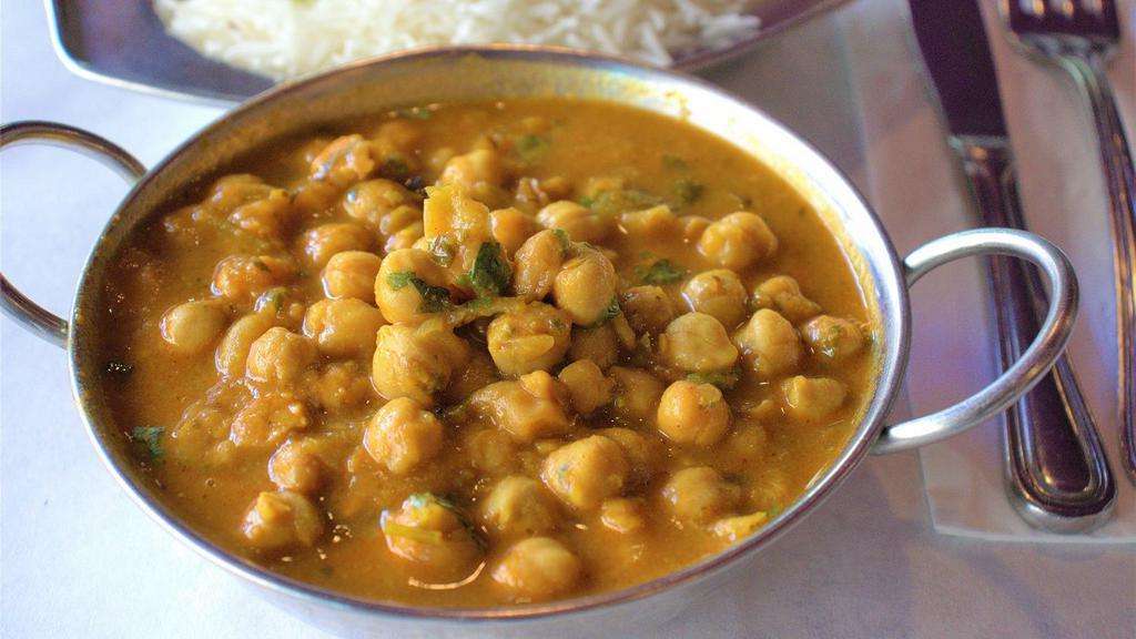 Channa Masala · Garbanzo beans cooked with onion, garlic and ginger.