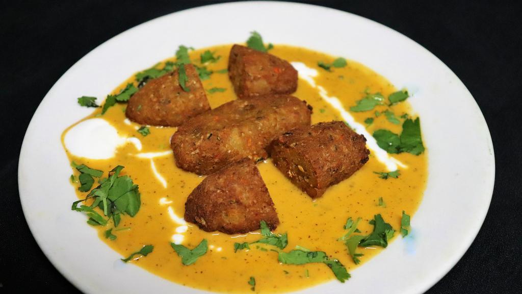 Malai Kofta · Freshly grated vegetable dumpling balls cooked in a delicate creamy onion sauce.