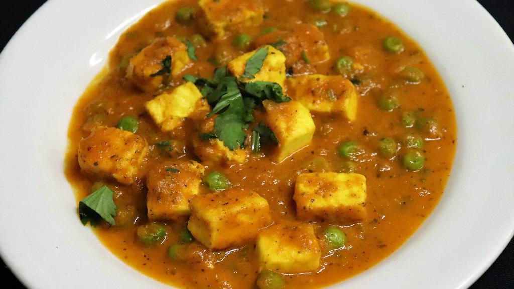 Matar Paneer · Paneer and greenpeas cooked in creamy onion and tomato gravy.