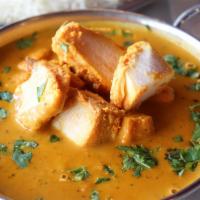 Chicken Tikka Masala · A typical North Indian home style boneless chicken curry in a mild sauce blended with select...