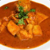 Chicken Vindalu · Chicken cooked in fiery hot spicy curry and spices with potatoes.