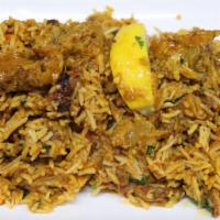 Goat Biryani · Goat cooked with basmati rice, nuts, raisins and spices (served with raita).