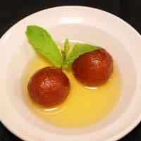 Gulab Jamun · Indian sponge cake served in a rich syrup.