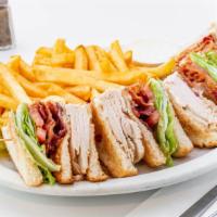 Club Sandwich · Fresh turkey breast sliced in a three layer sandwich with
mayo, lettuce, tomato, pickles and...