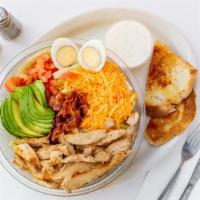 Cobb Salad · Grilled Chicken, bacon, avocado, tomatoes, hard boiled egg, and Cheddar cheese. Served with ...