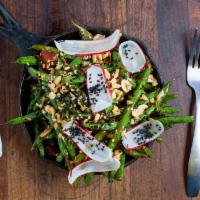 Blistering Blue Lake Green Beans · Sweet and spicy chili sauce, crispy pork, fresh thai basil, lime juice, and peanuts.